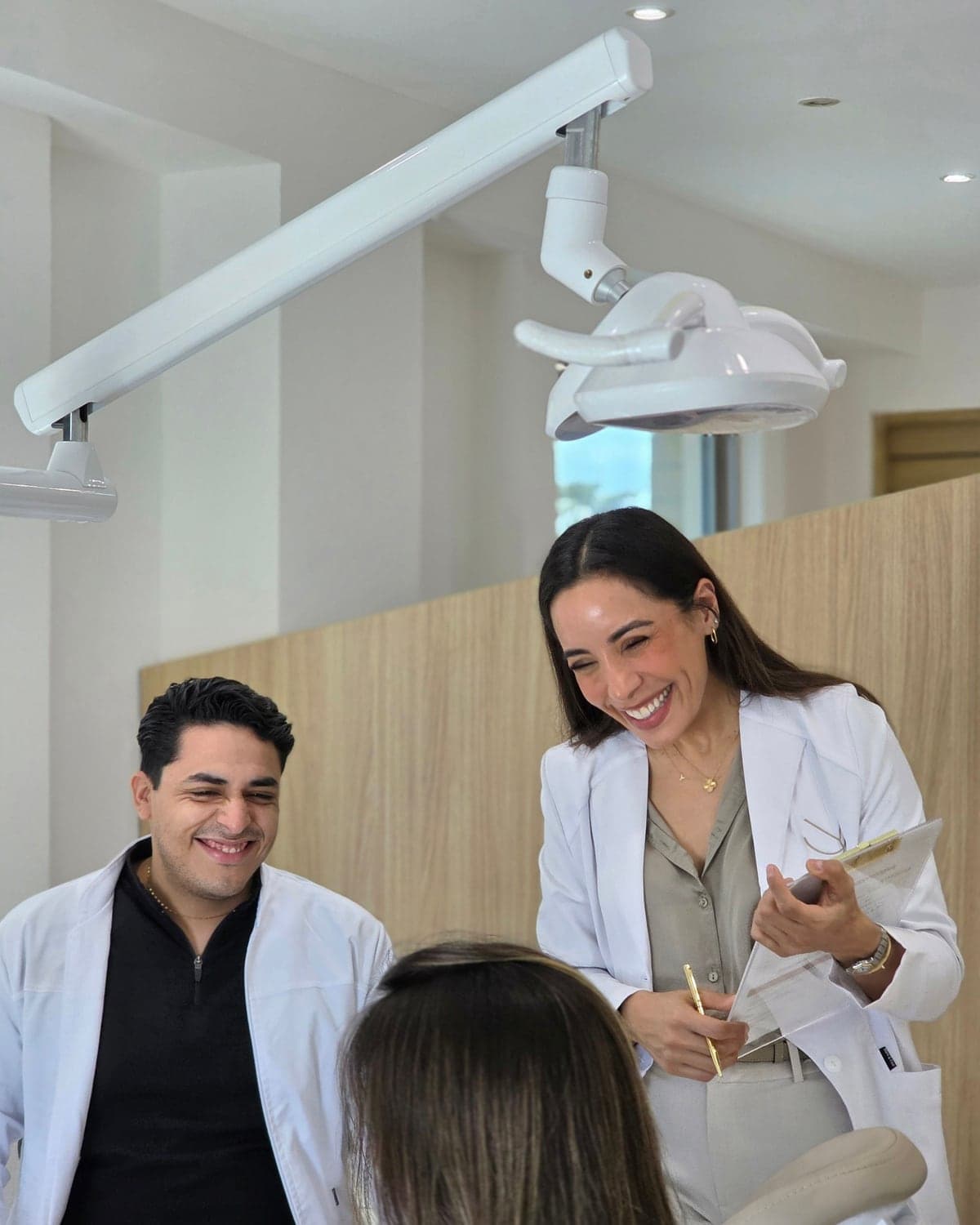 The practice team attending at the dental chair